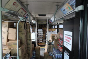 donated non-perishable items inside the Jolly Trolley Food Drive Metro Bus.