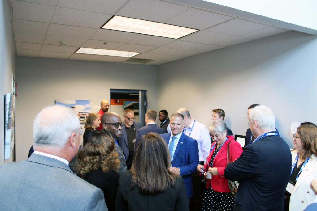 Group touring the St. Cloud New Flyer facility, August 14, 2025.