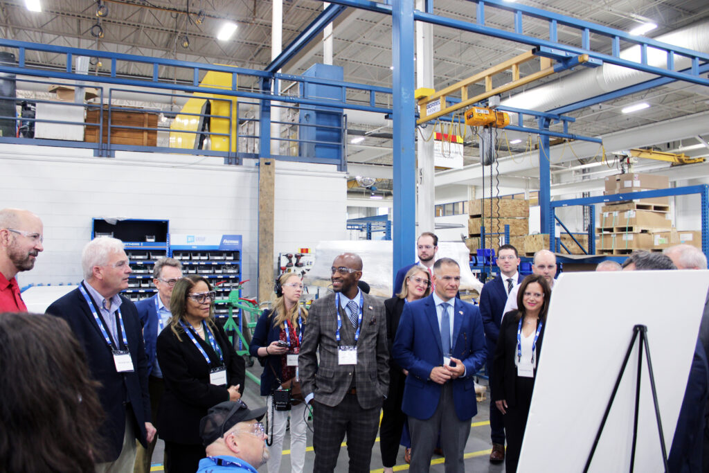 A group of people touring the New Flyer facility.